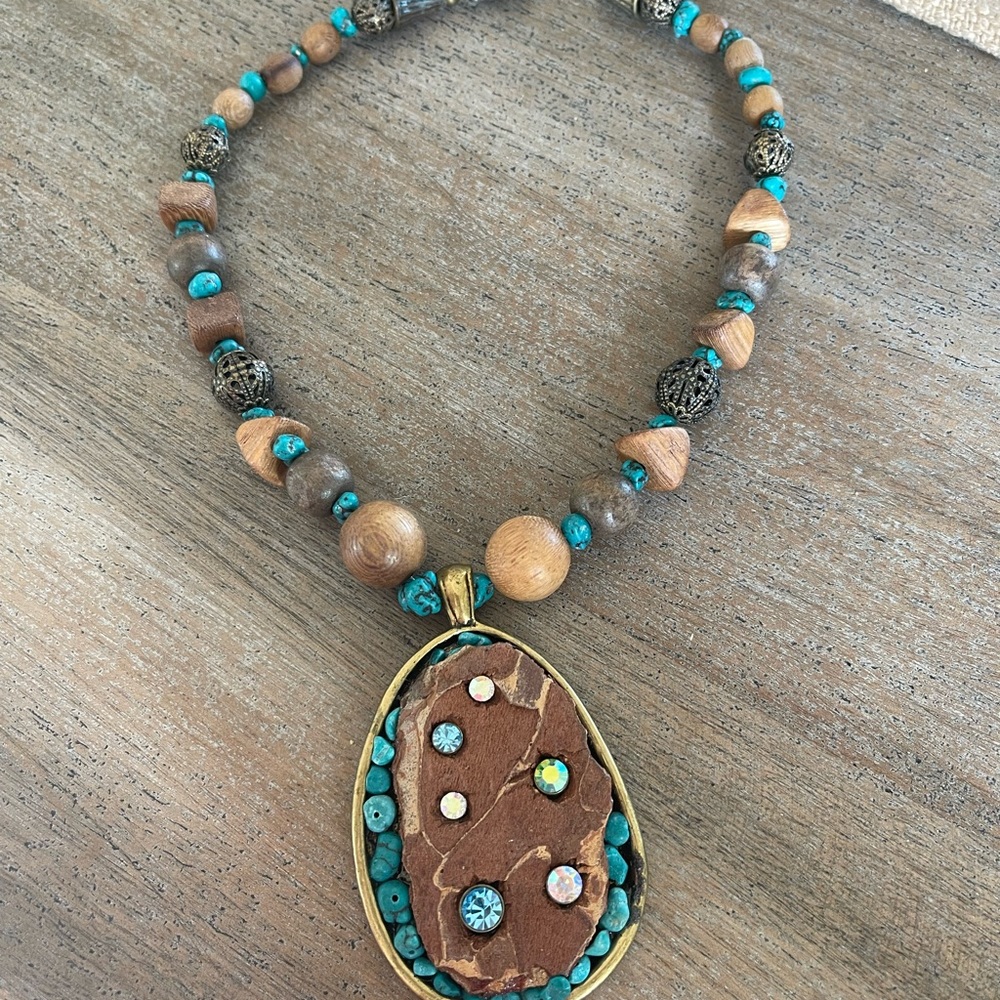 Necklace with gems and crystals